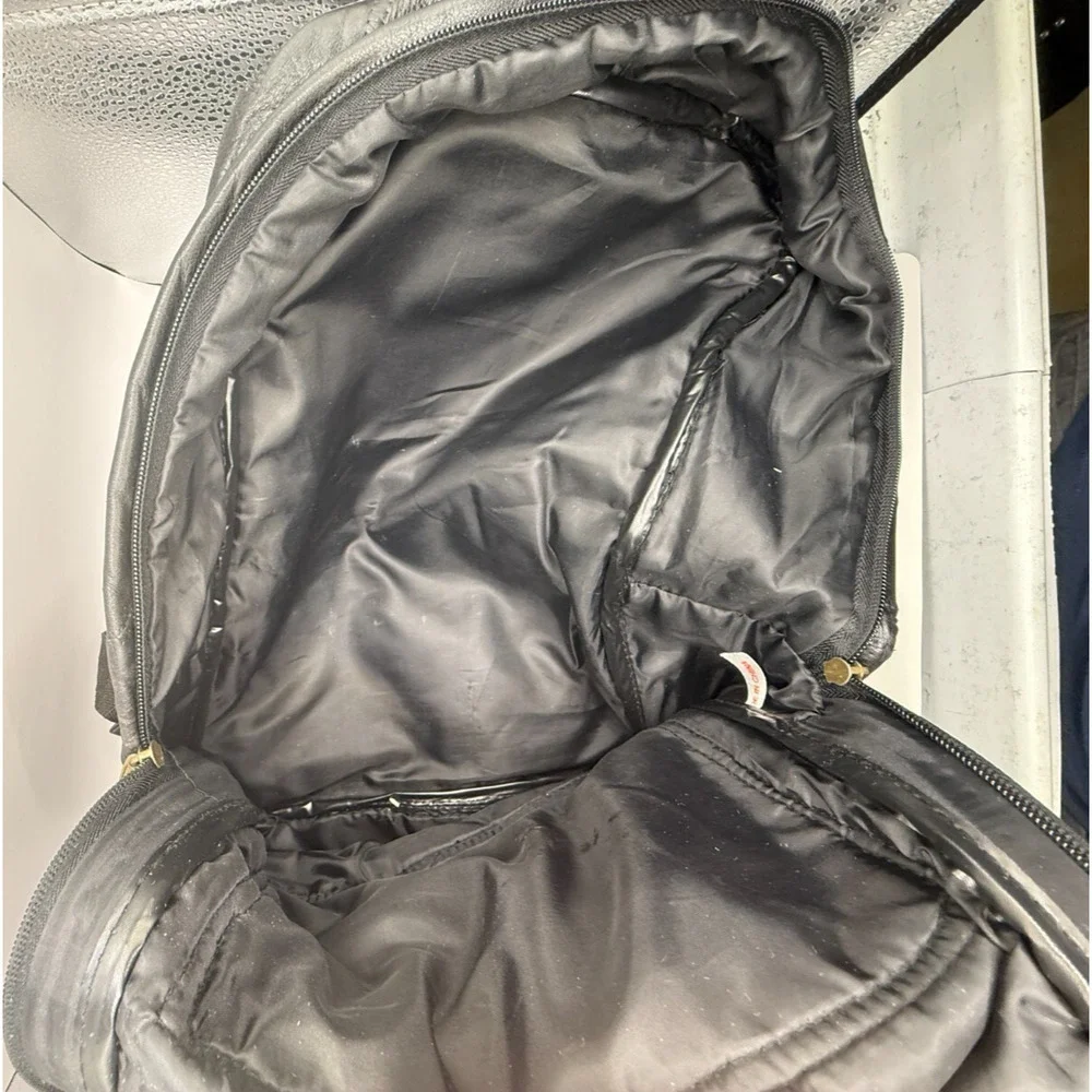 Vintage Patchwork Leather‎ Backpack – Classic Black Travel Bag with Unique Style